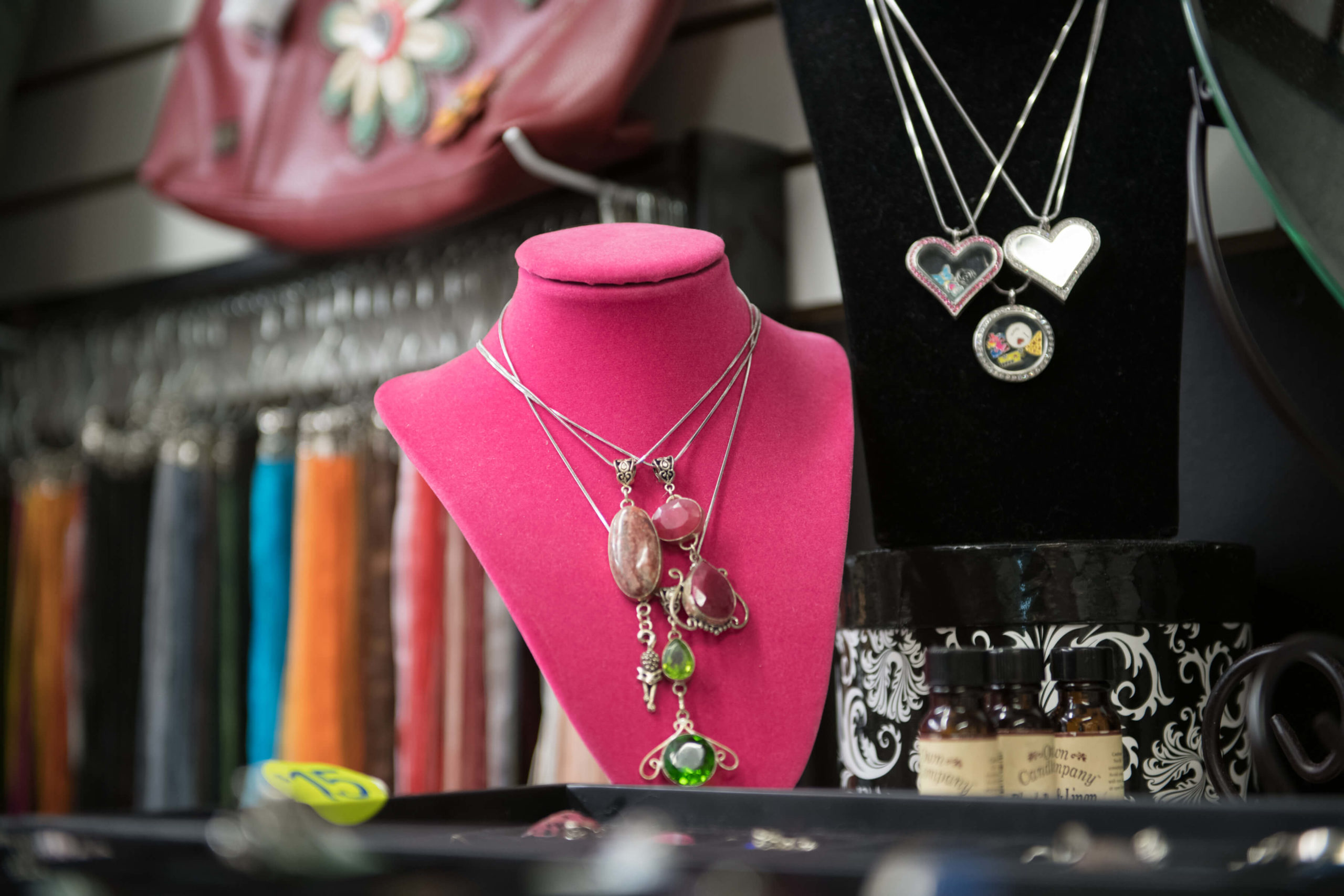 A beautiful handcrafted necklace is on display at a jewelry stand at The Markets.