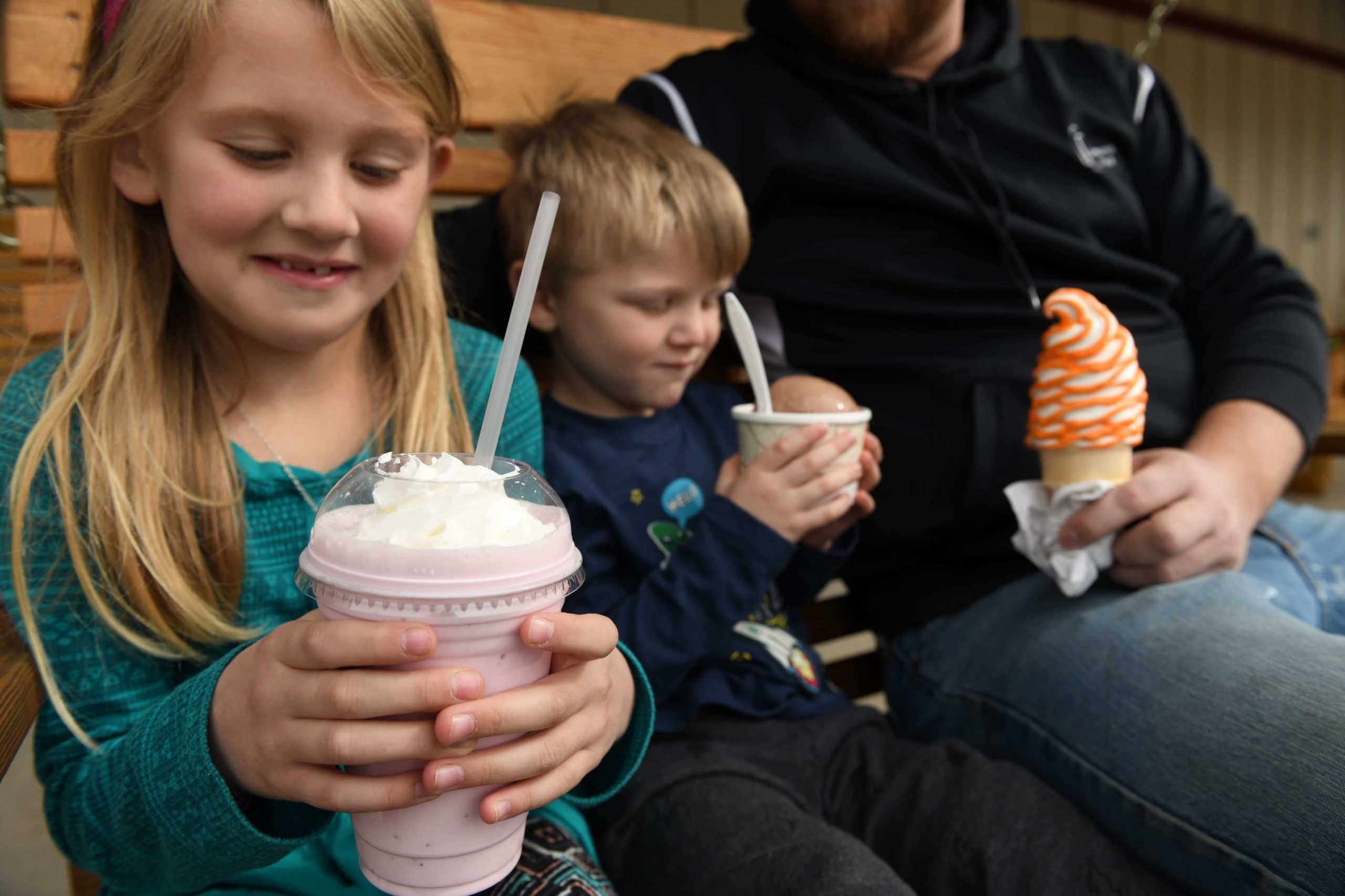 A brother and sister enjoy ice cream treats at The Markets!