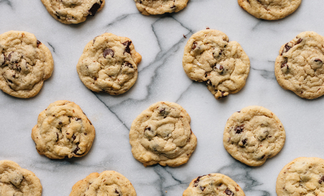 close up of rows of chocolate chip cookies