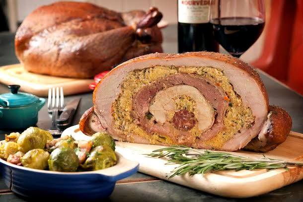 unique farmers' market food: holiday table with carved Turducken 