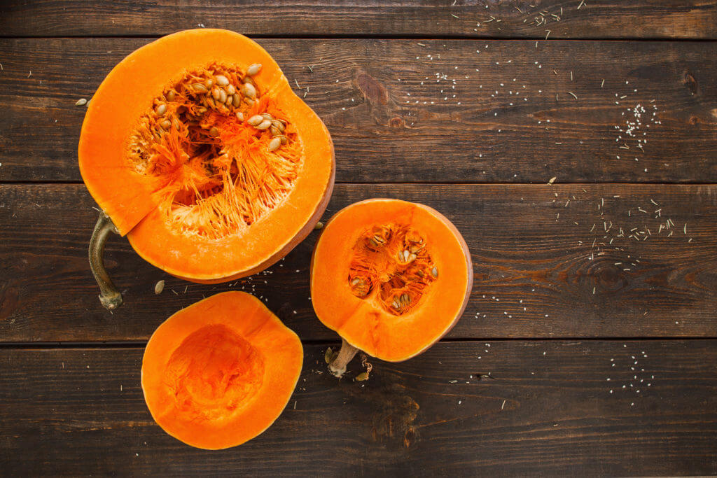 pumpkins used for cooking, cut in half and seeds scooped out