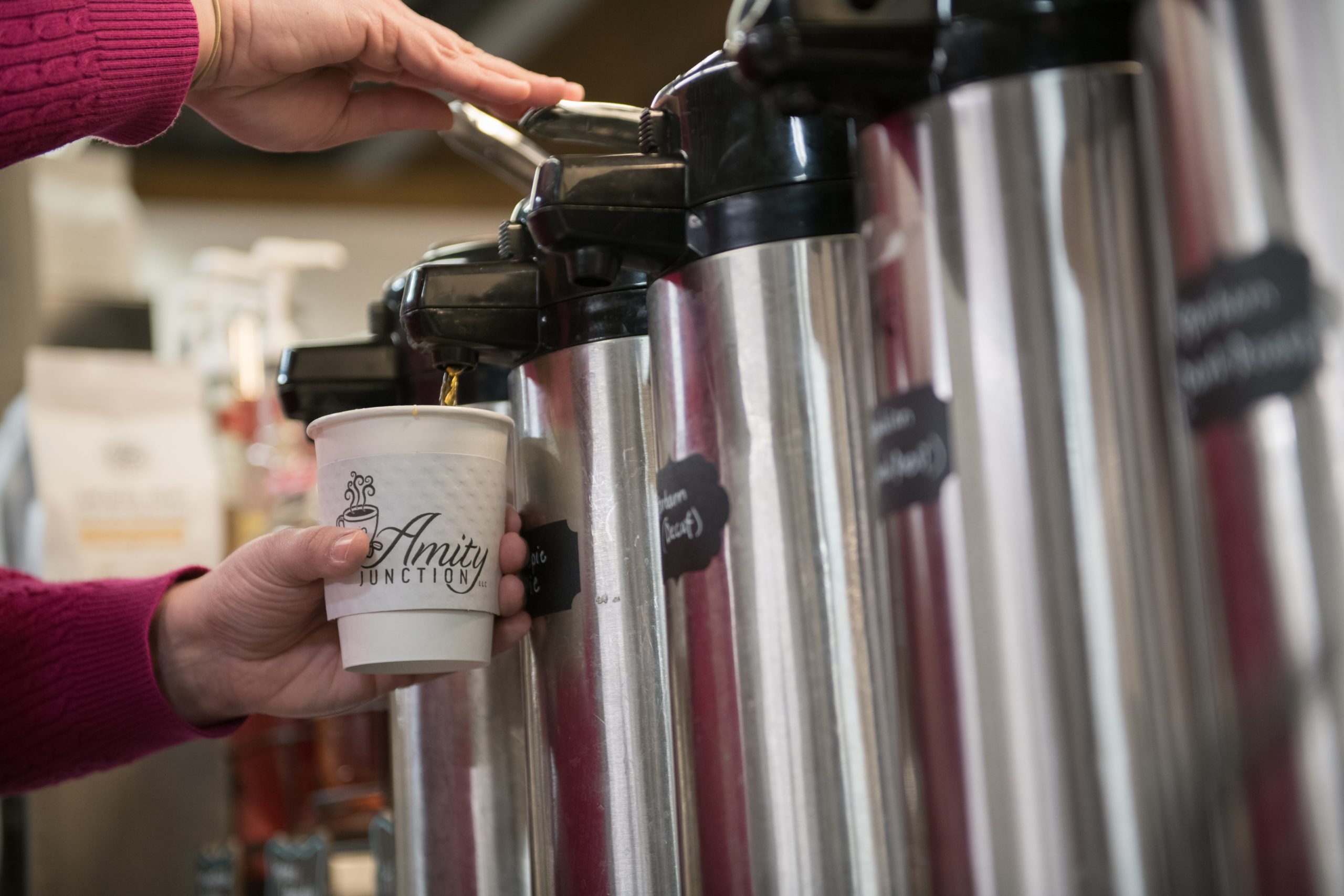 A Markets shopper pours freshly brewed coffee.