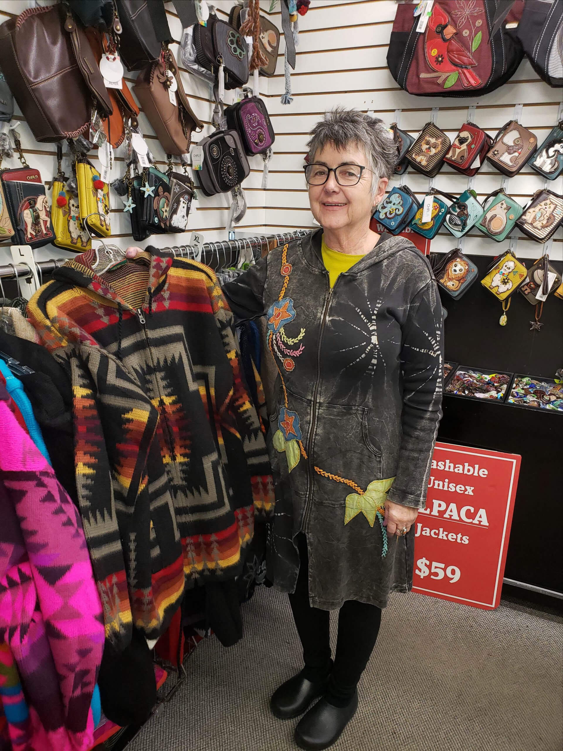 A Markets at Shrewsbury shopper looks at an alpaca sweater.