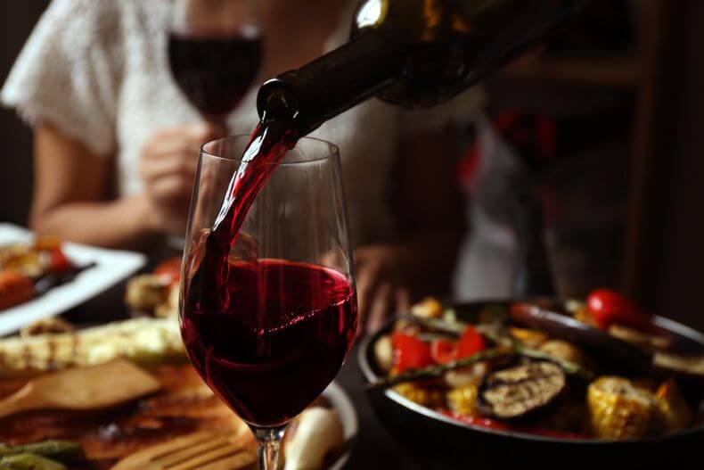 A table enjoys food and wine pairing together.