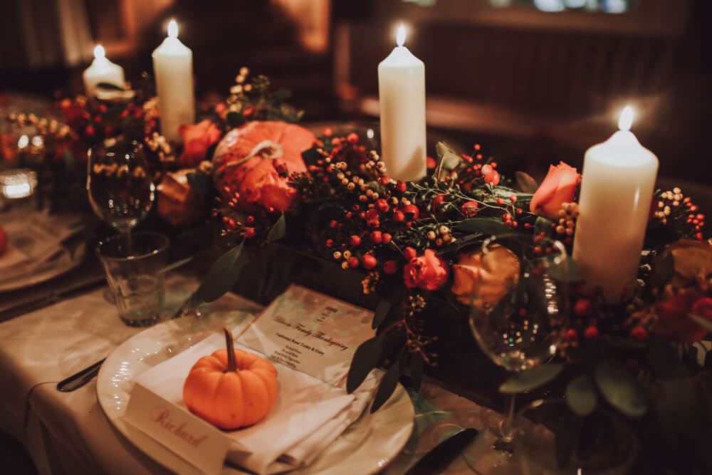 A table is set with traditional Thanksgiving dishes.