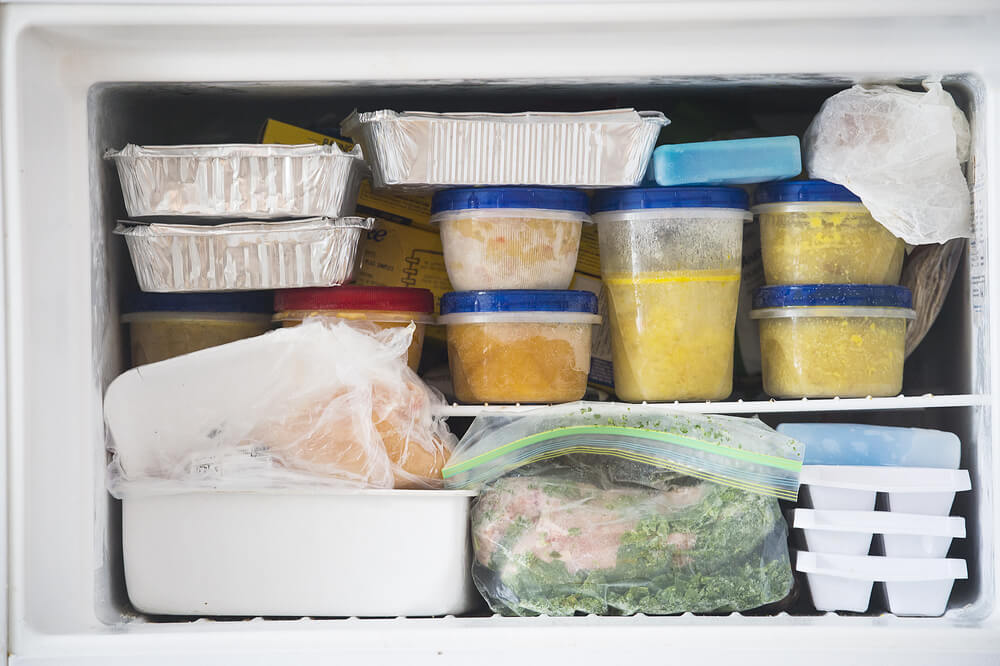 Bowls of chicken corn soup sit in the freezer.