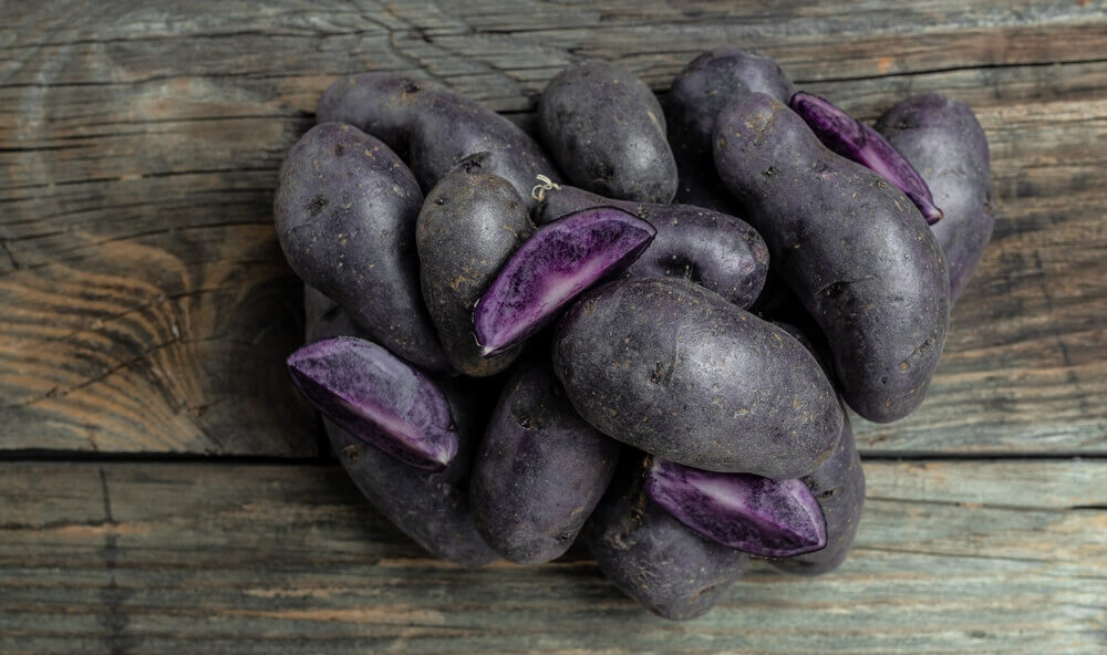 Group of small, purple potatoes