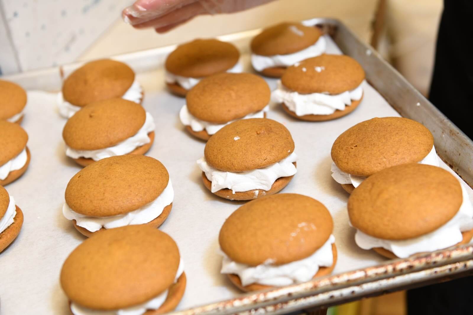 Amish-baked pumpkin whoopie pies on a baking sheet