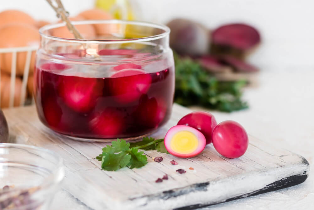pickled red beet eggs in a jar