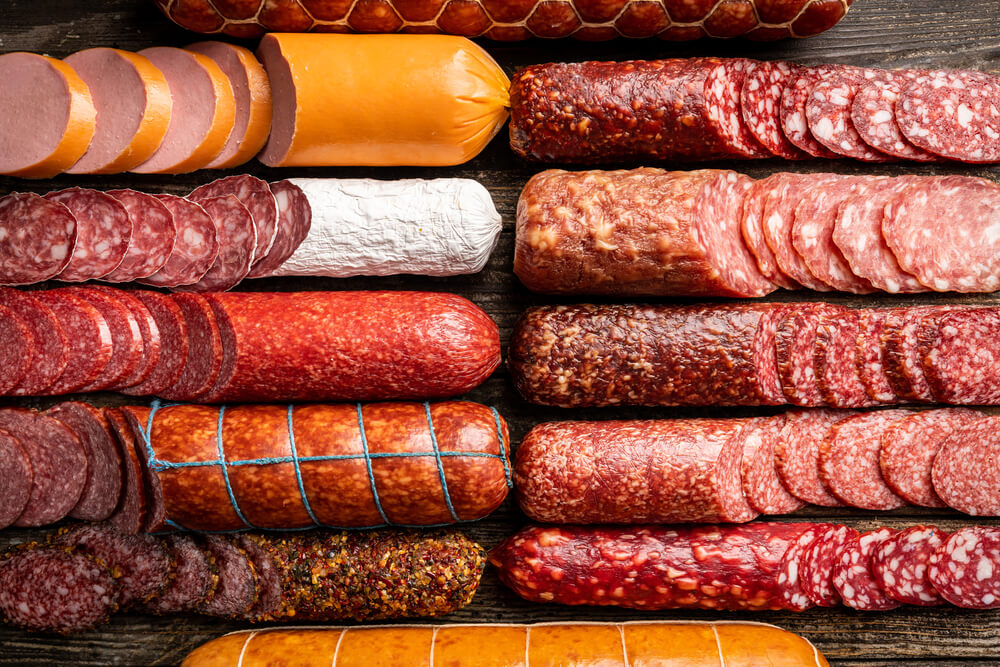 an assortment of meats and salamis