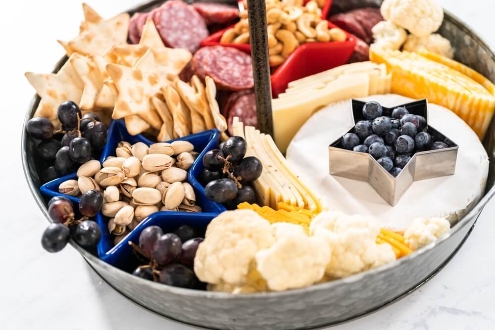 a red, white, and blue assortment of items on a 4th of July themed charcuterie board