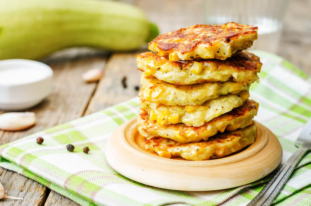 stack of corn fritters on a plate 