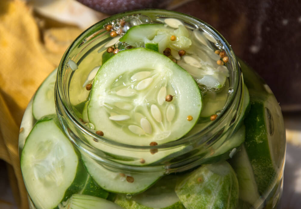a bird-eye view of a jar of quick pickled cucumbers 