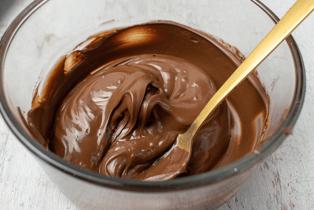 Chocolate icing in a glass bowl to put in an Amish Whoopie Pie