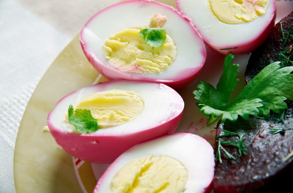 Close-up of hard-boiled Dutch pickled beet eggs.
